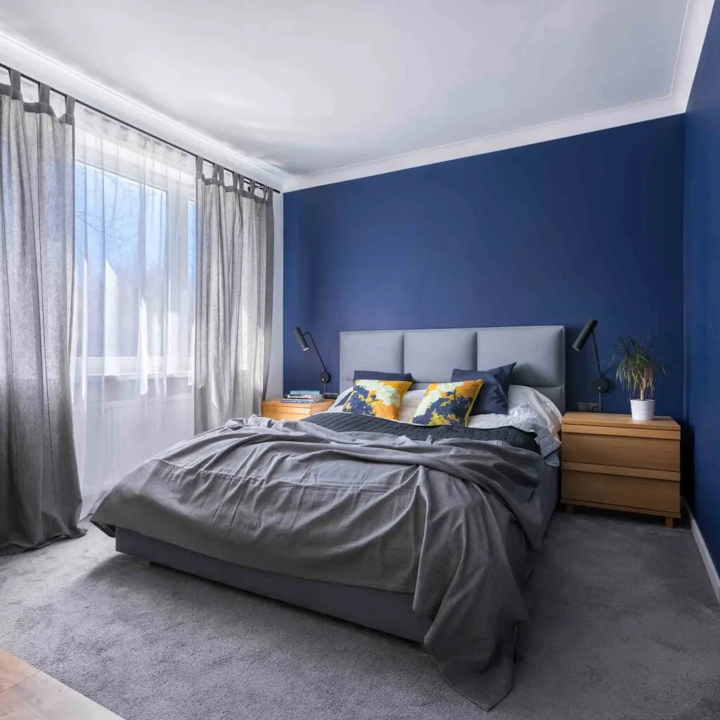 Modern bedroom painted in blue, one of the best colors that are relaxing