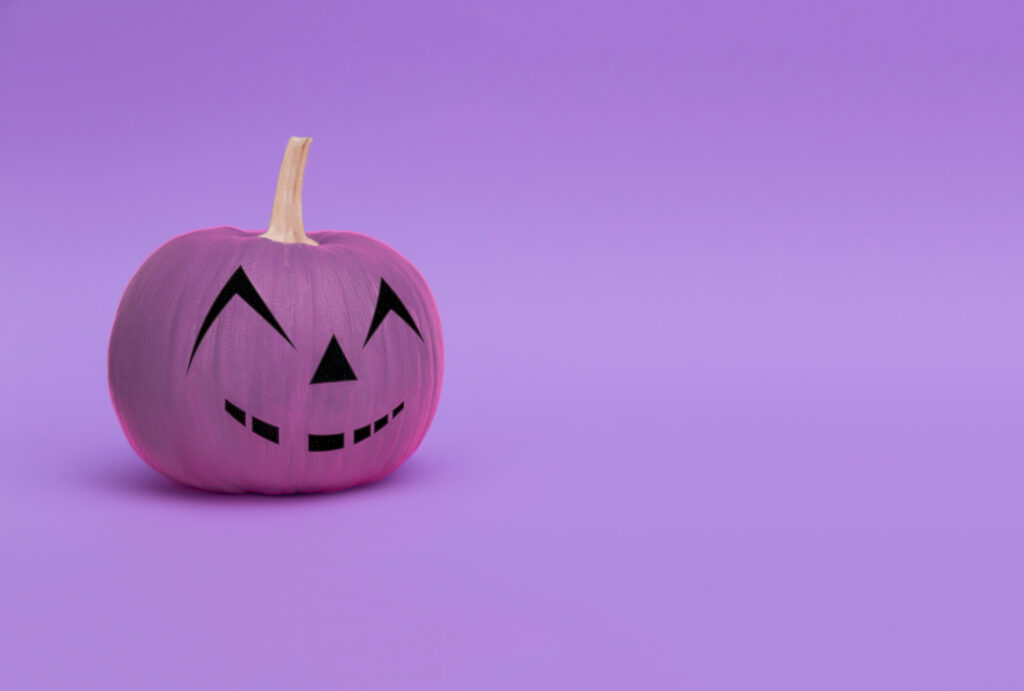 Purple pumpkin on purple background