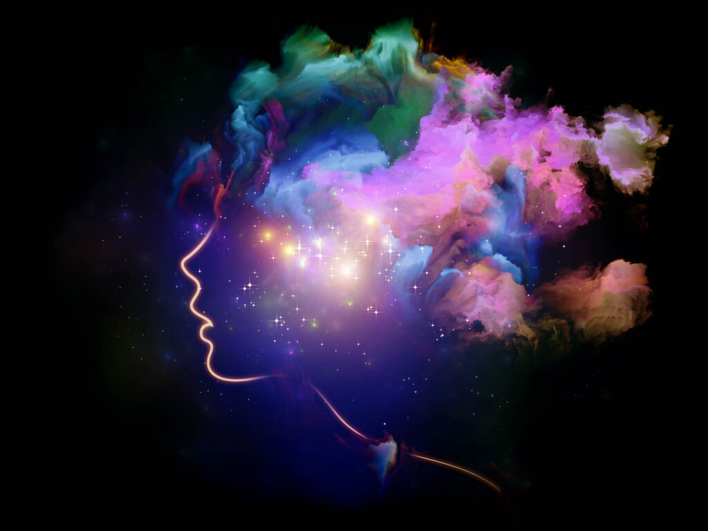 Silhouette of woman's face and head dreaming in color