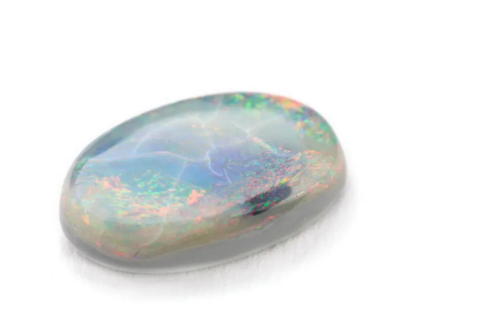 White opal gemstone on white background