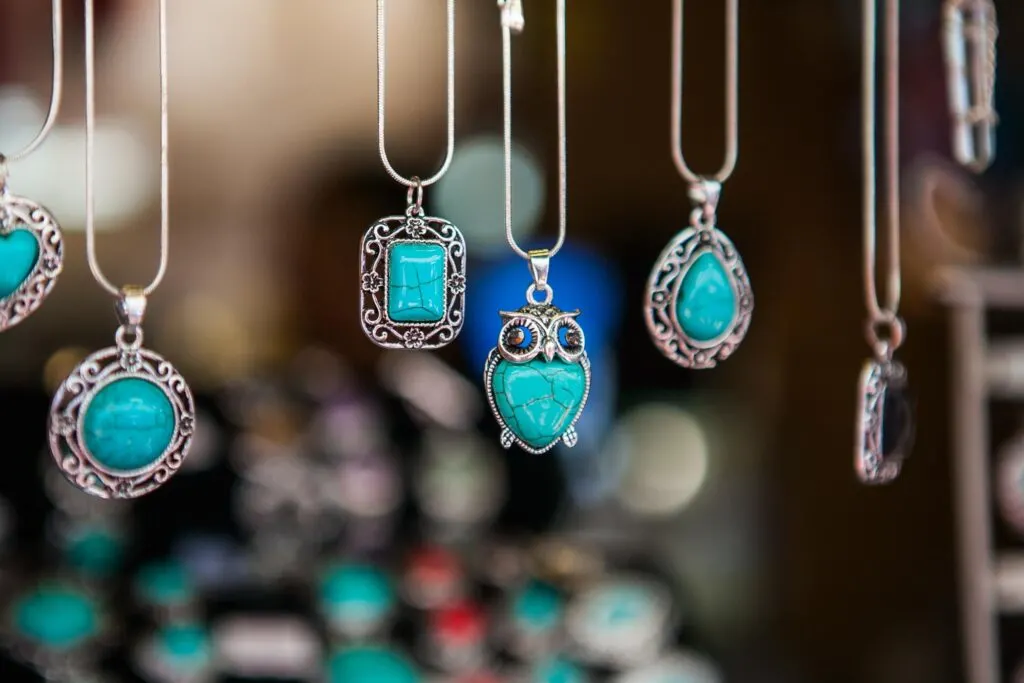 Necklaces with turquoise pendants hanging alongside