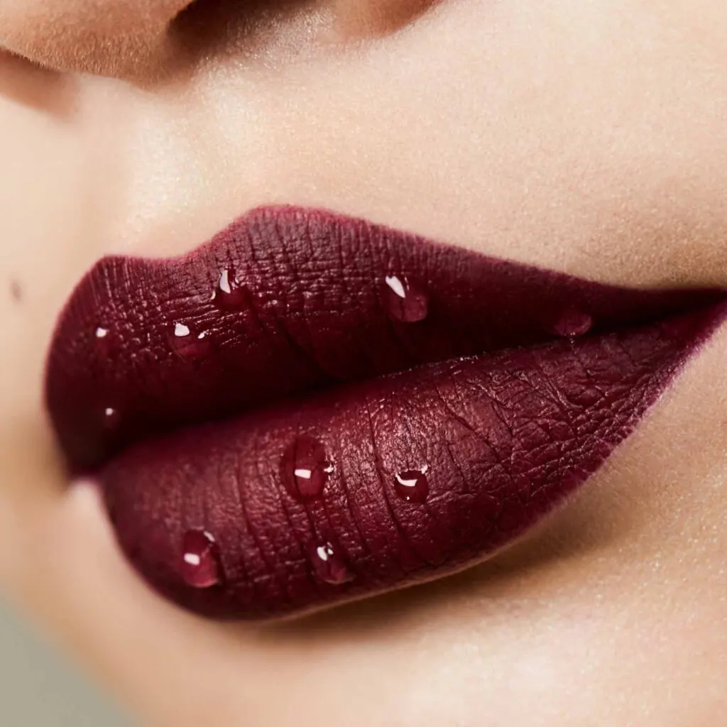 Burgundy lips with water drops