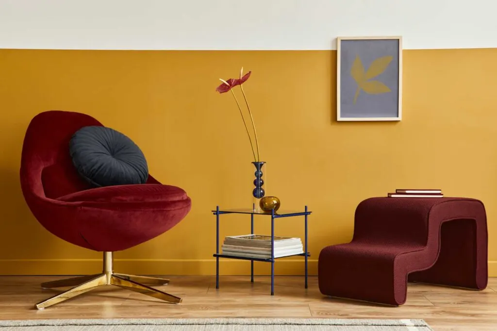 Unique living room in modern style with yellow wall and red armchair
