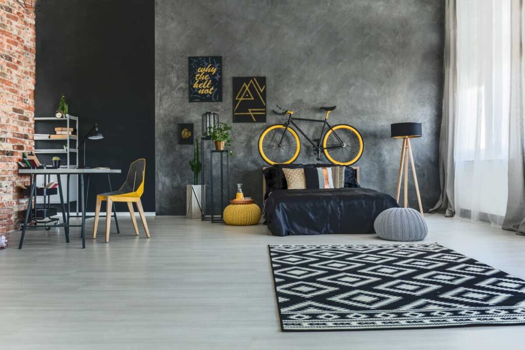 Multifunctional black loft interior with yellow accents