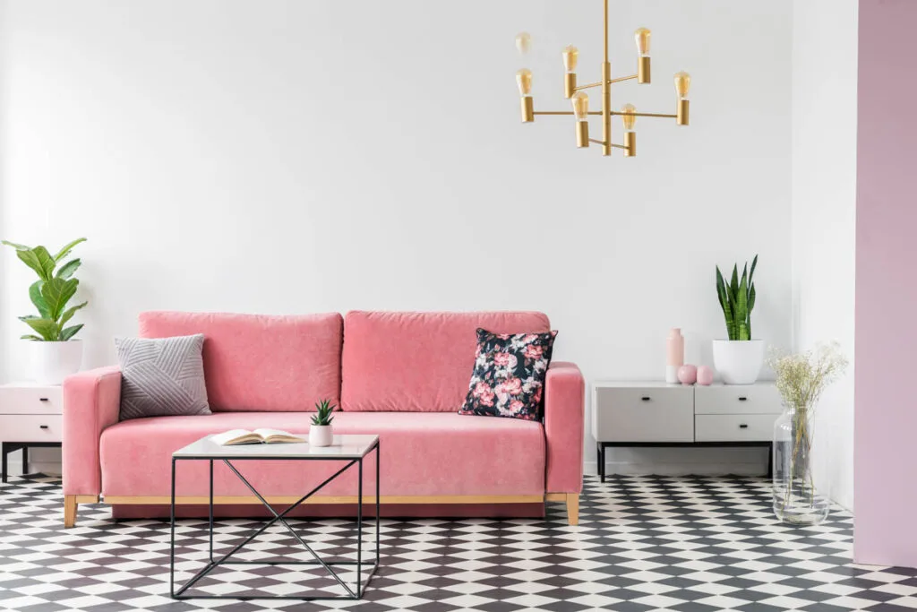Black and white living room with pink couch
