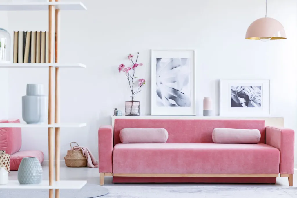 Pink couch on a white living room