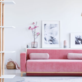 Pink couch on a white living room