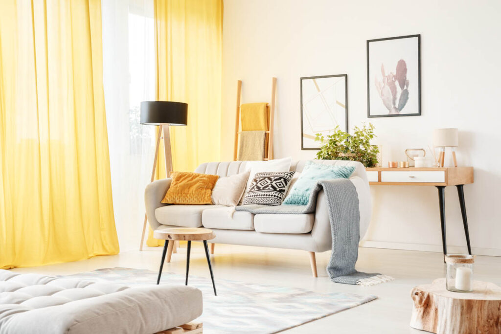White living room with yellow curtains