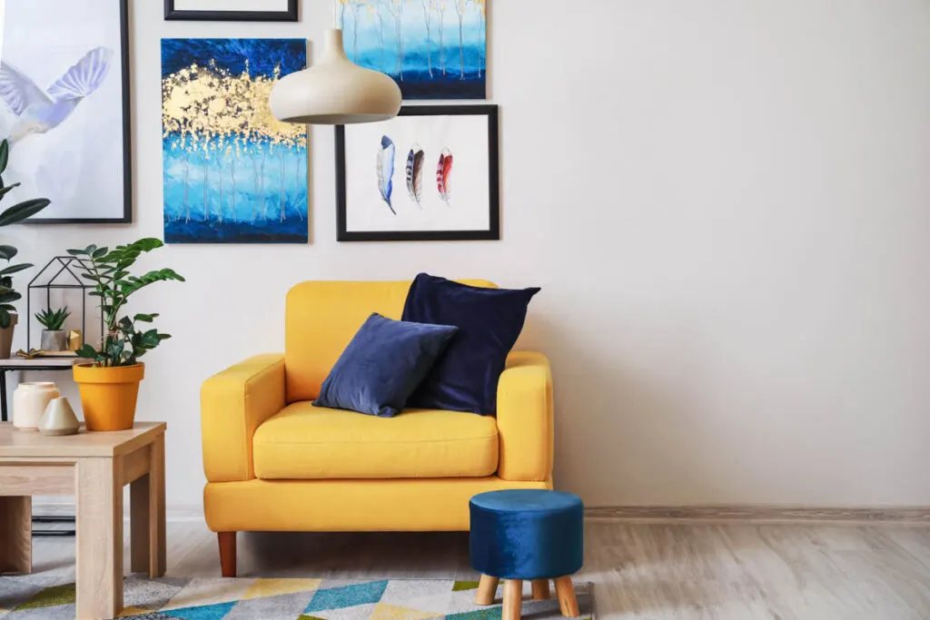 Yellow armchair and blue pillows