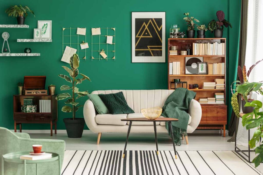 Emerald green wall and beige decor in living room
