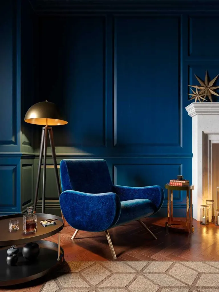 Royal blue armchair next to a fireplace in a blue living room