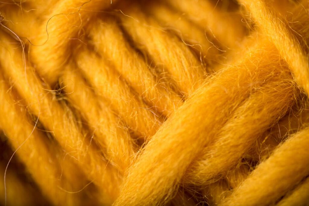 macro closeup of mustard wool yarn