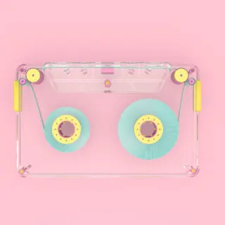audio cassette on pastel colored background