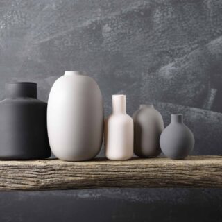 various neutral colored vases in gray, black, and white colors