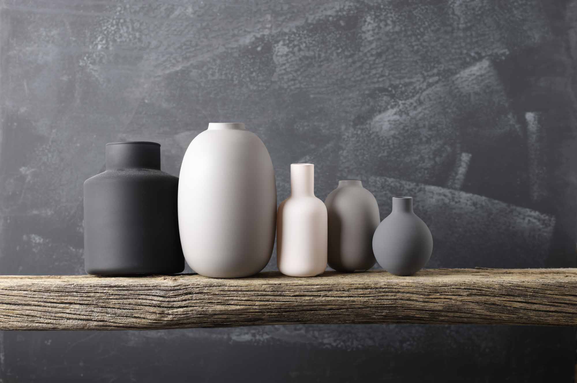 various neutral colored vases in gray, black, and white colors